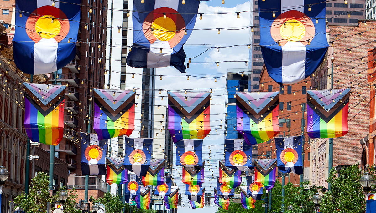 Colorado and Pride flags hang above Larimer Square