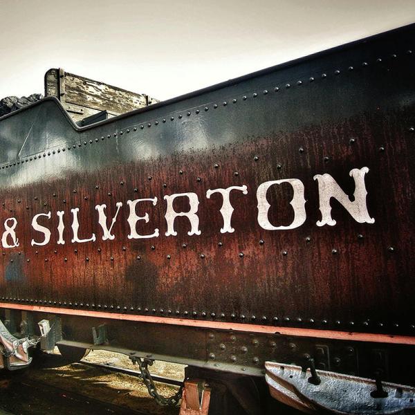 Black train car that says Silverton on the side