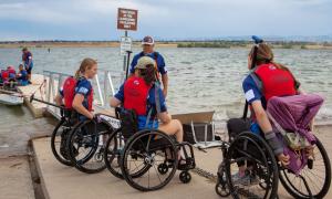 From left, Claire Thomas, Liz Mahoney, Bob Nelson, and Alison Rehfus line up to load into the Team Blue boat.