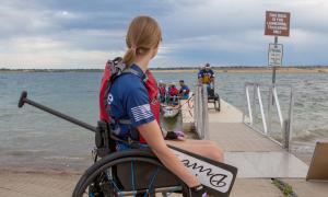 Claire Thomas waits to join her fellow adaptive athletes on the Team Blue dragon boat.