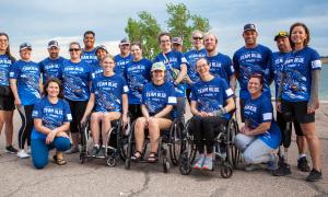 Team Blue dragon boat members gather following a practice at Standley Lake in Westminster.