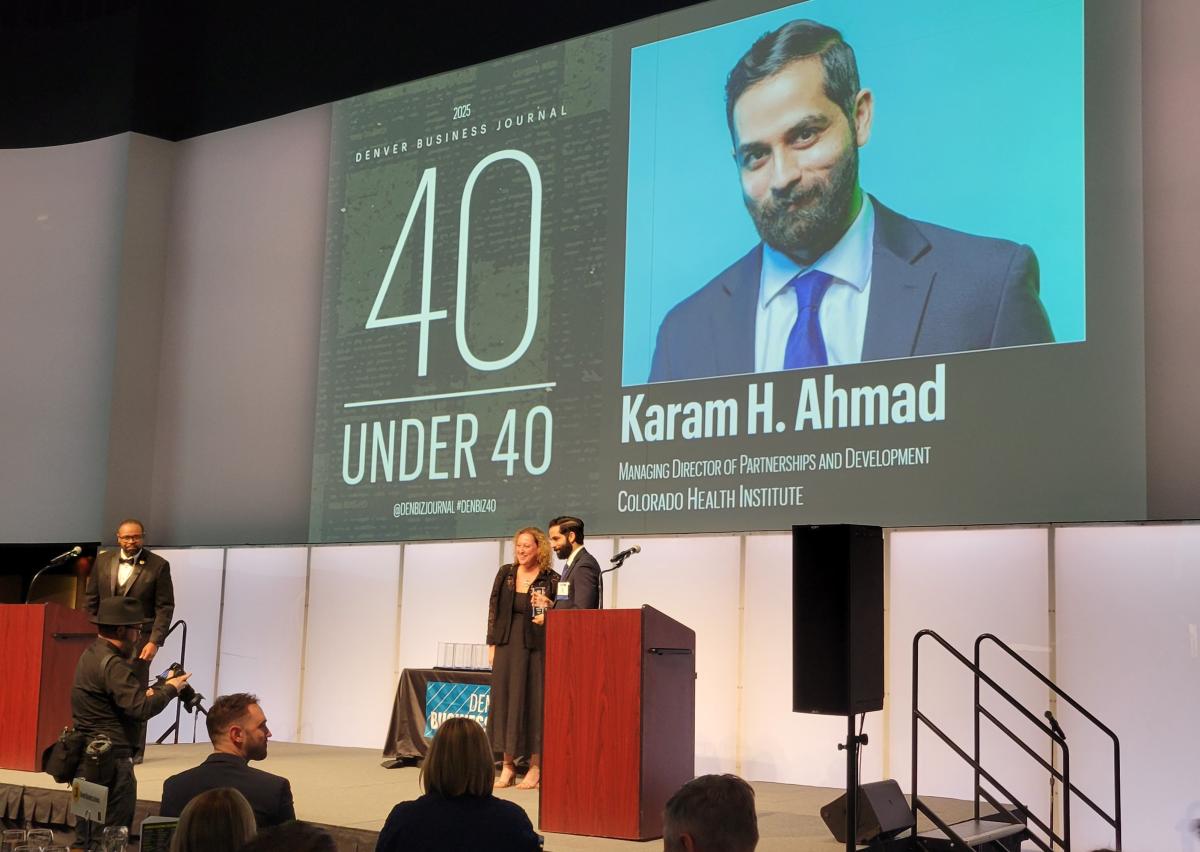 Karam Ahmad on stage accepting his 40 Under 40 award